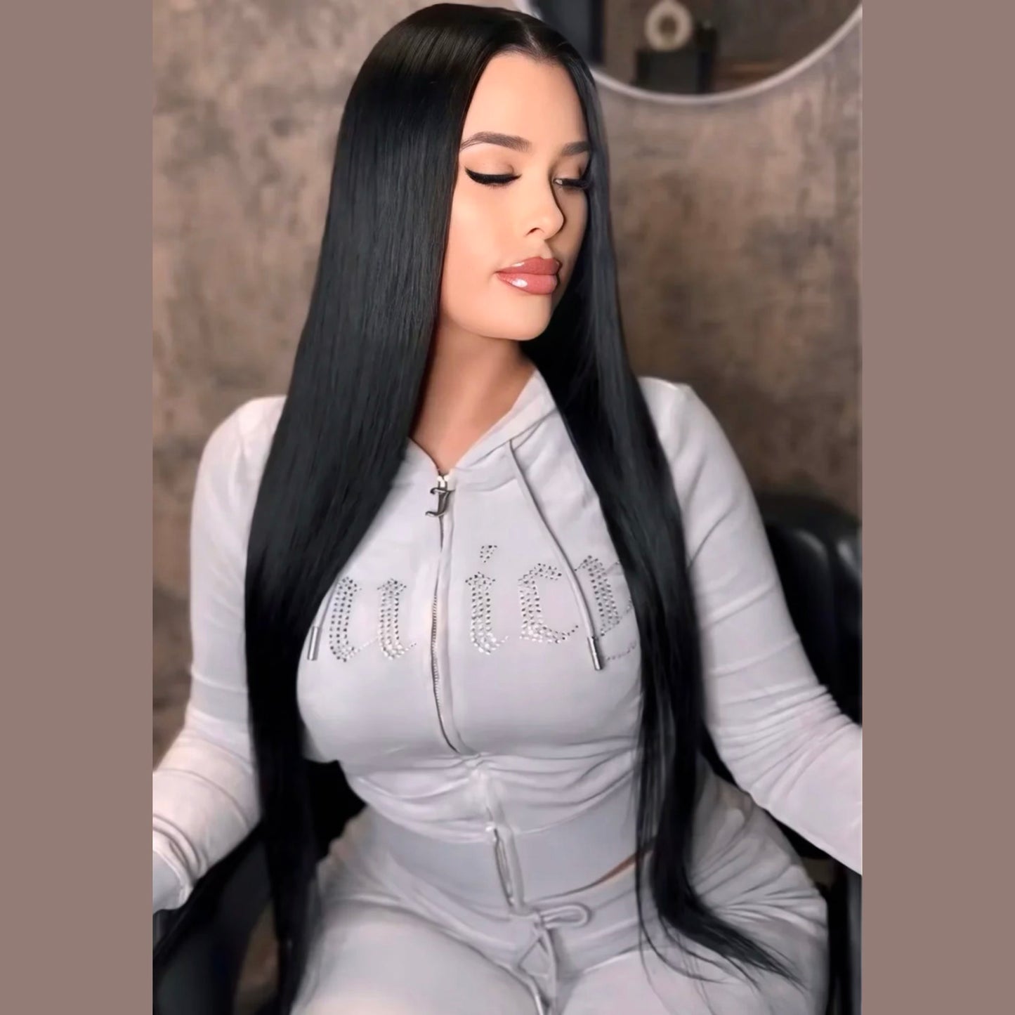 Woman with long jet black hair extensions - raw hair bundles