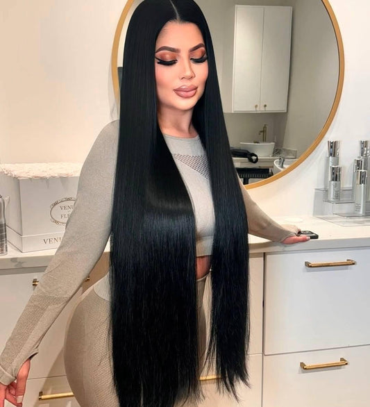 Woman with long jet black hair extensions - raw hair bundles